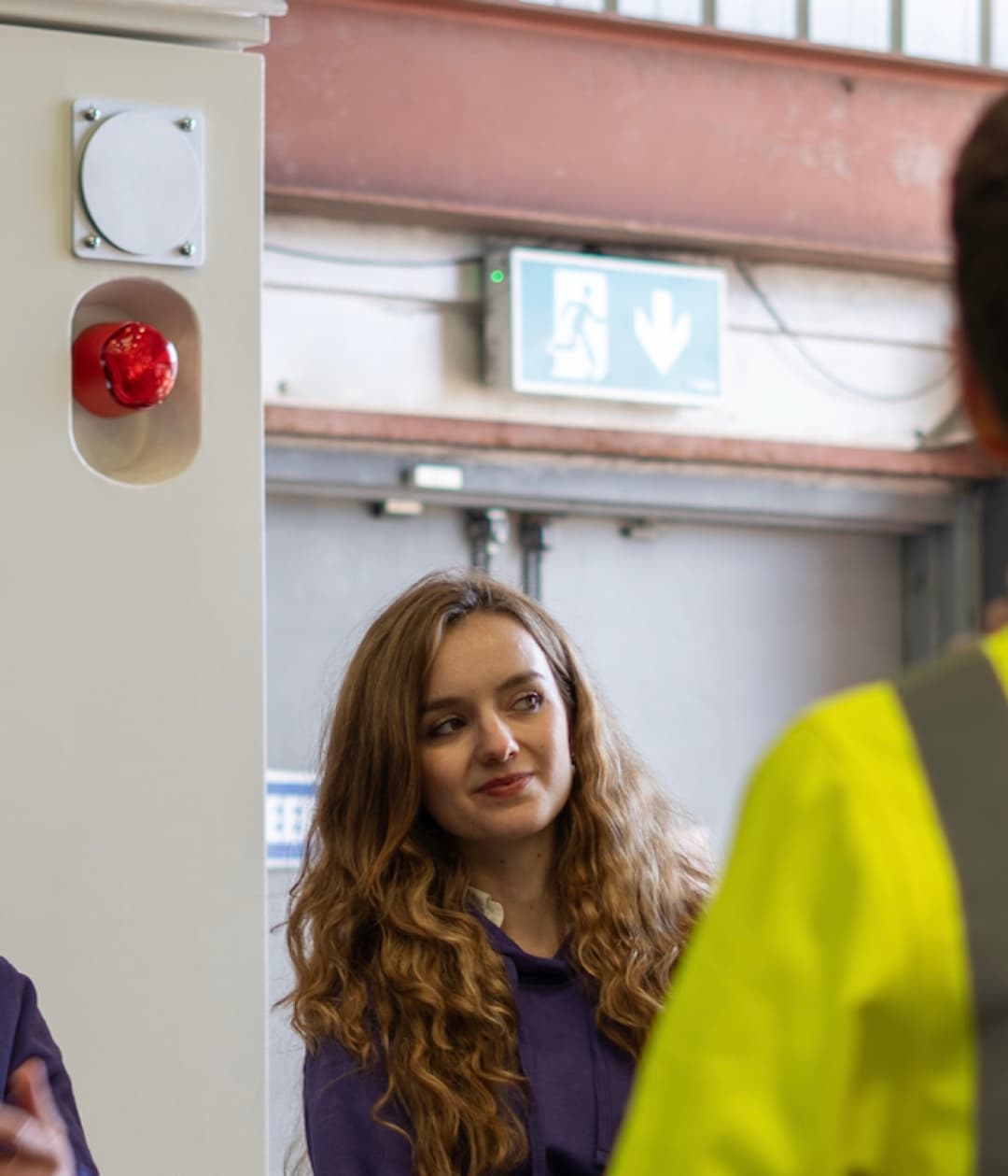 Annamaria talking with a colleague in high-visibility clothing at an energy site