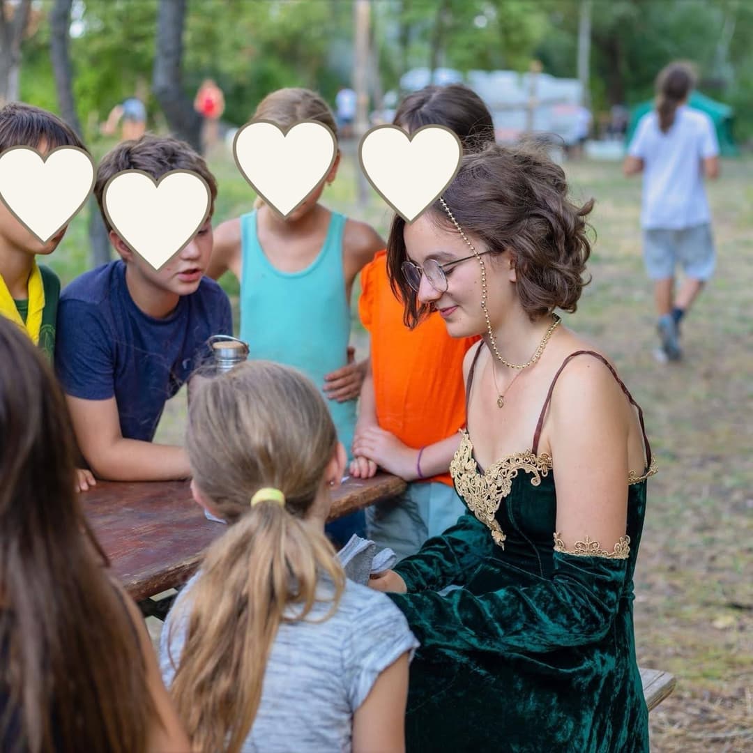 Scout activity at a table with children’s faces covered for privacy